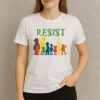 Save-PBS-–-Resist-Rainbow-Character-Graphic-Protest-Tee-USA